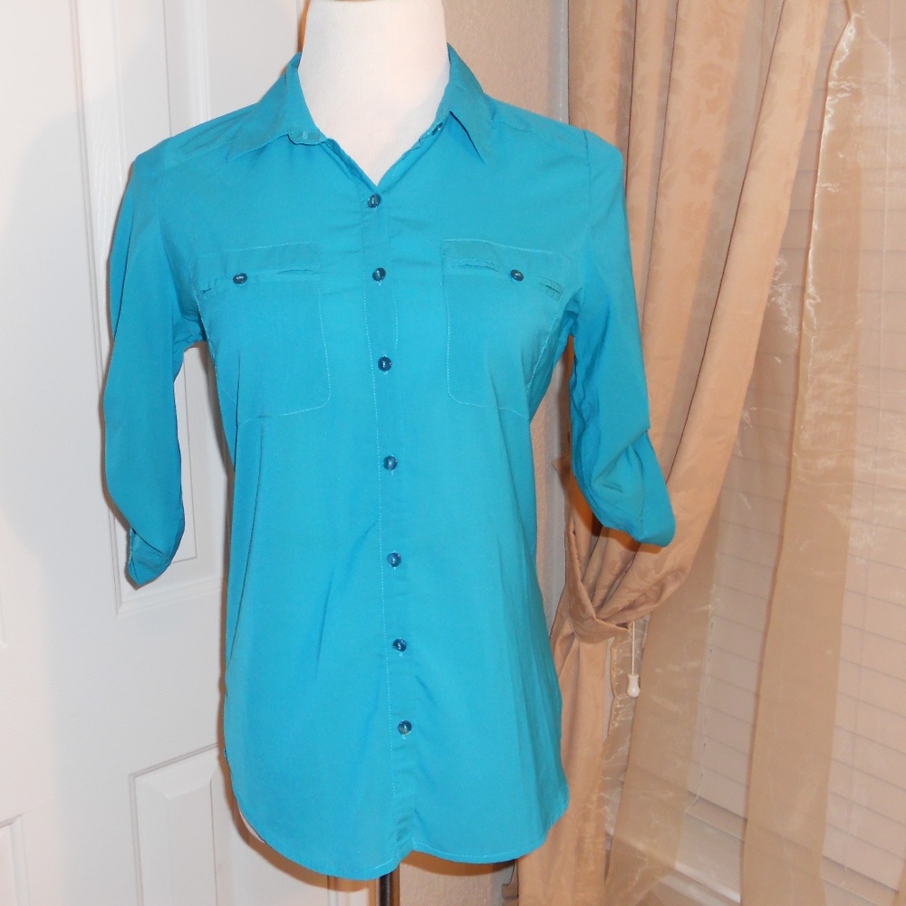 Turquoise women's button up shirt.